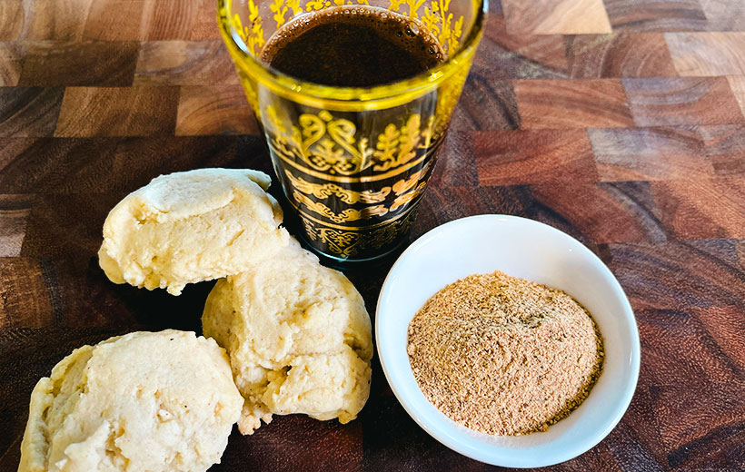 Sugar cookies baked with Mediterranean twist of "Coffee Break" spice blend. On the right, a small bowl with the coffee hawaij spice blend, and black Middle-Eastern coffee.