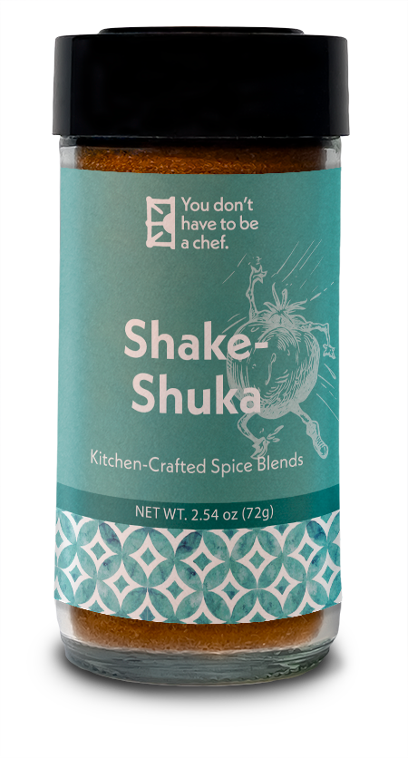 A bottle of Shake-Shuka spice blend for enhancing the flavors of tomato sauce in shakshuka, with a mix of Mediterranean spices.